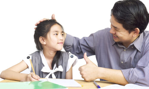 Daddy teaching his kid during doing homework Daddy teaching his kid during doing homework