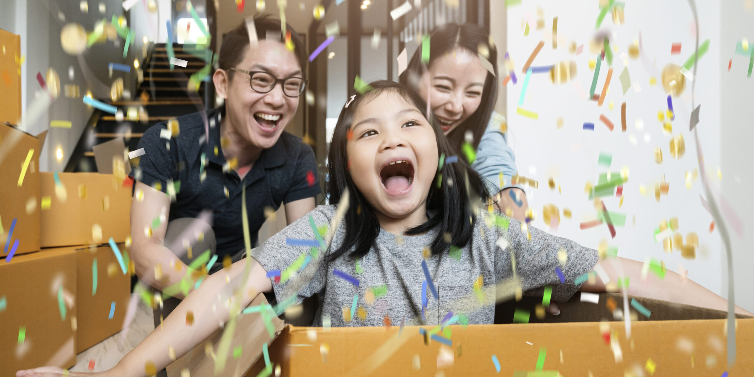 happiness asian family mom dad daughter moving in new house hand