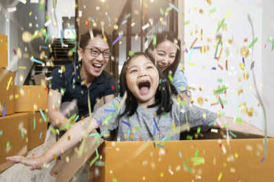 happiness asian family mom dad daughter moving in new house hand happiness asian family mom dad daughter moving in new house hand carry box of stuff with exited and fun cheerful expression